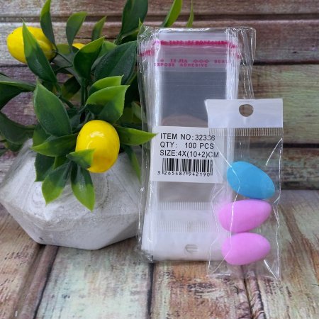 مجموعة (100كيس) تغليف شفاف مع تعليقة وشريط لاصق حجم 4*10 سم